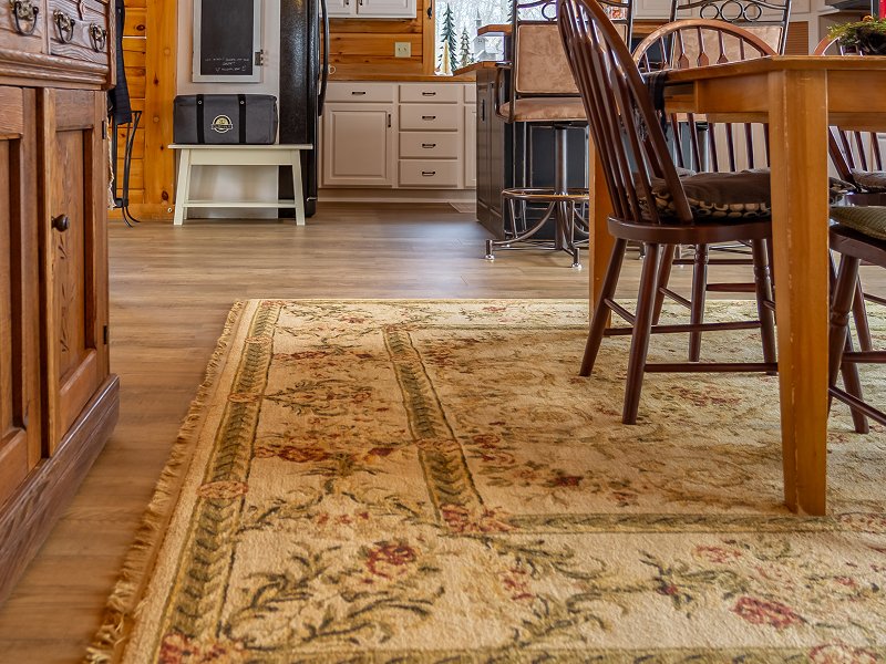 Living room in a New Providence, PA cabin with a custom-bound rug