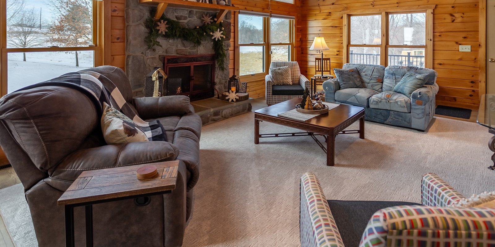 Living room in a New Providence, PA cabin with a custom-bound rug